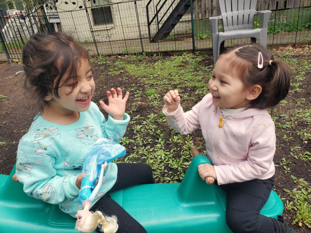 Two girls playing at Global Roots Play School